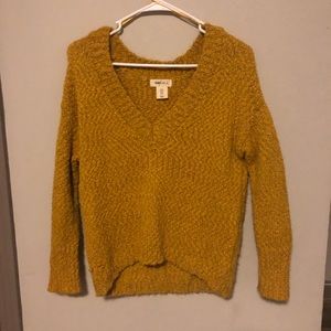 Yellow sweater slightly cropped